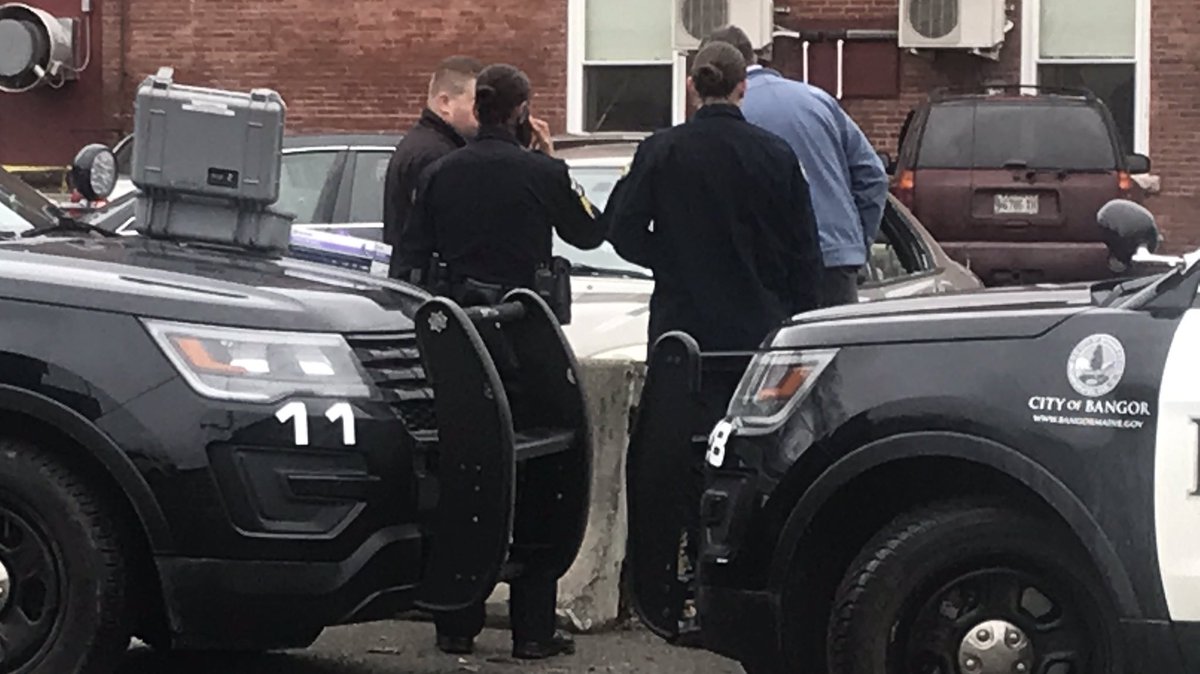 Police has set up crime scene tape around the Bangor Homeless Shelter parking lot directly across the street from the police department. The mobile crime unit is also on scene, investigating inside of one car parked in the lot. 